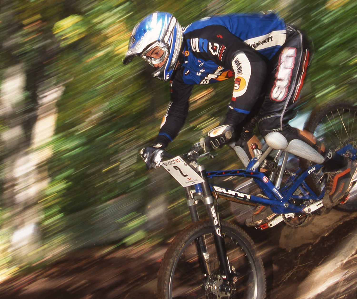 Cedric racing with competition gear on and helmet