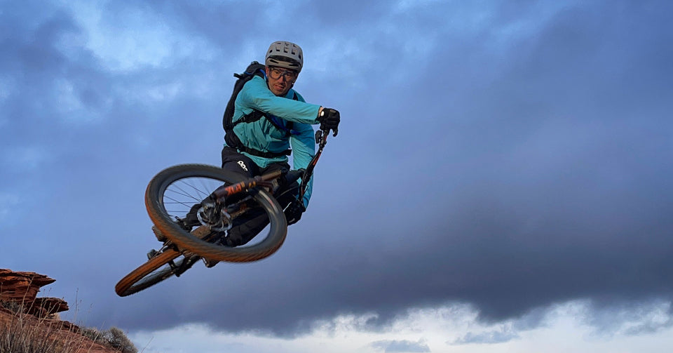 Eric on a mountain bike hitting a jump