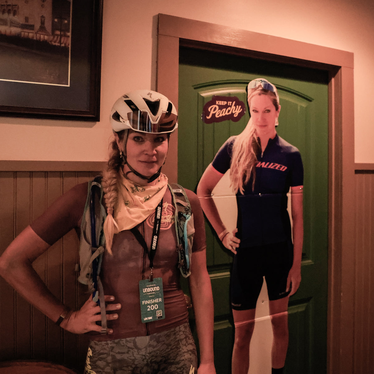 alison posing next to a photo of herself