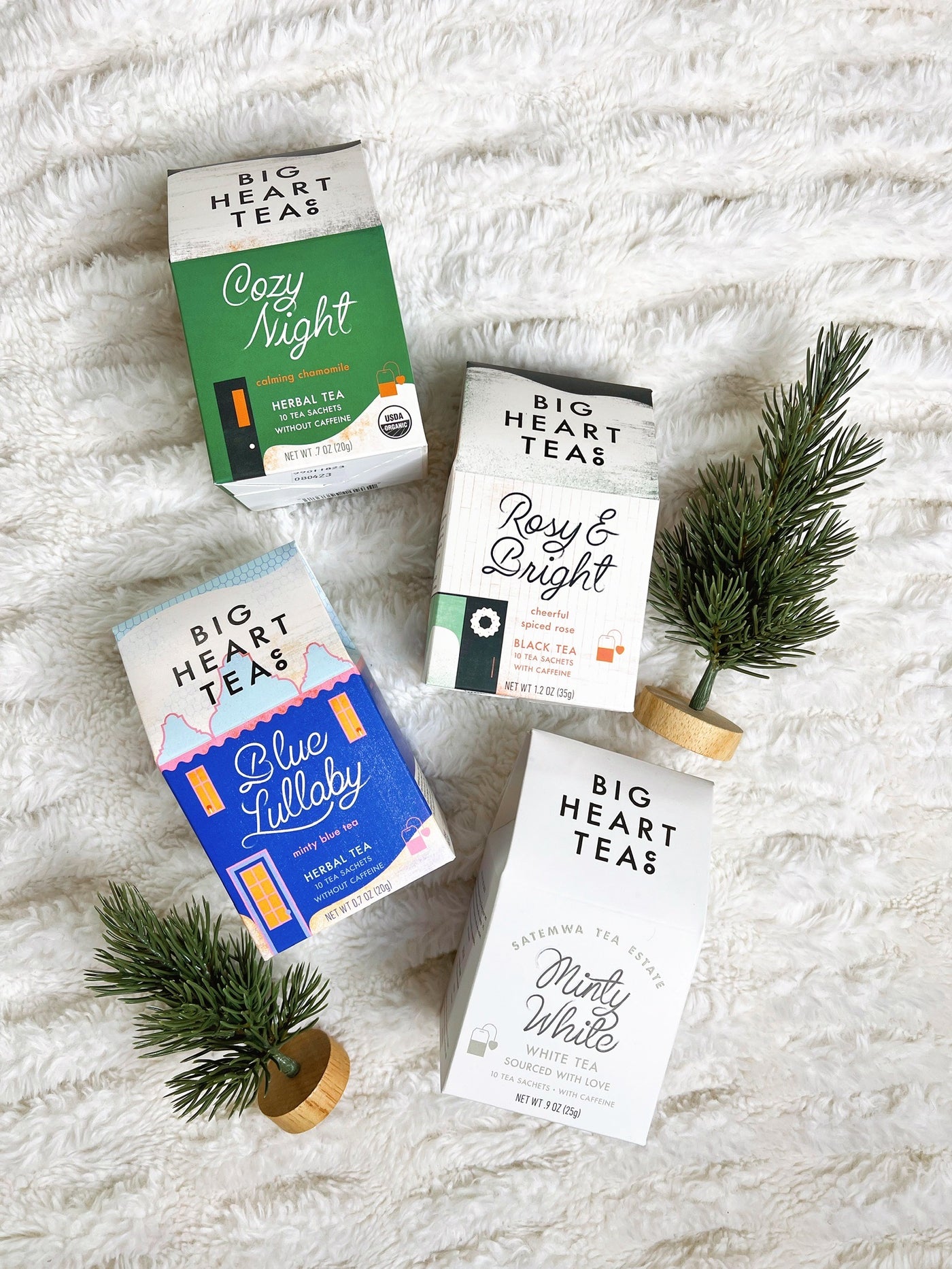 four boxes of tea bags: cozy night, blue lullaby, rosy and bright, minty white