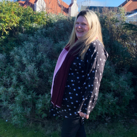 Lee in Knitted Scarf in Rhubarb, Raspberry and Black