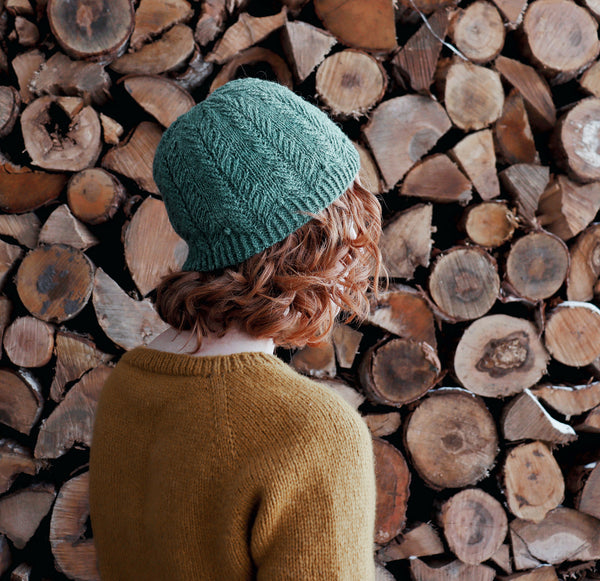 The Bough hat in Teal with twisted stitches and bobbles