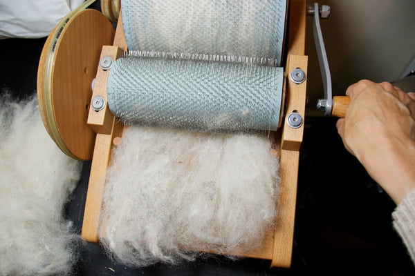 Carding wool on a drum carder