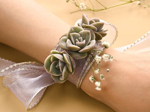 Bridesmaid Corsages made with lovely roses and ribbons