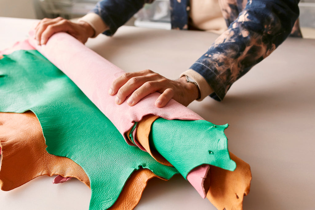 Rolling up sheets of leather