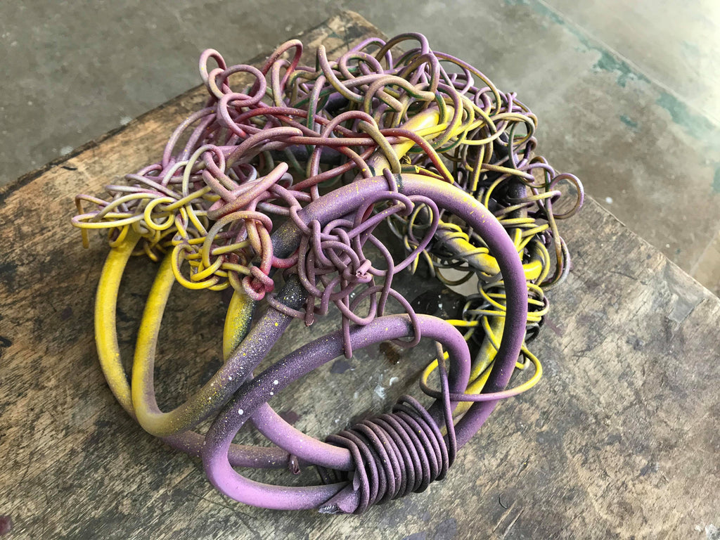 Wiry sculpture in lilac and yellow