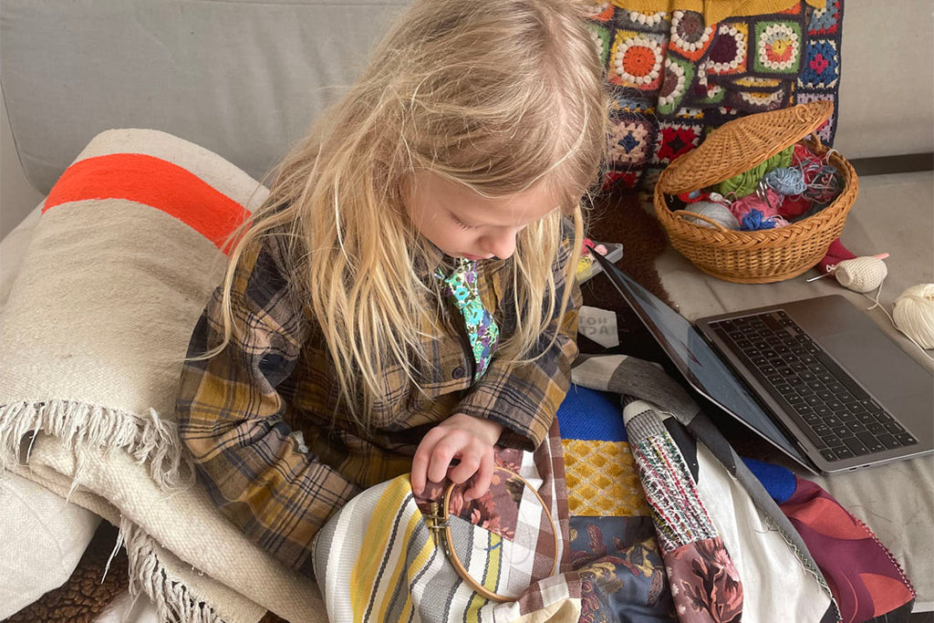 Morris embroidering a quilt