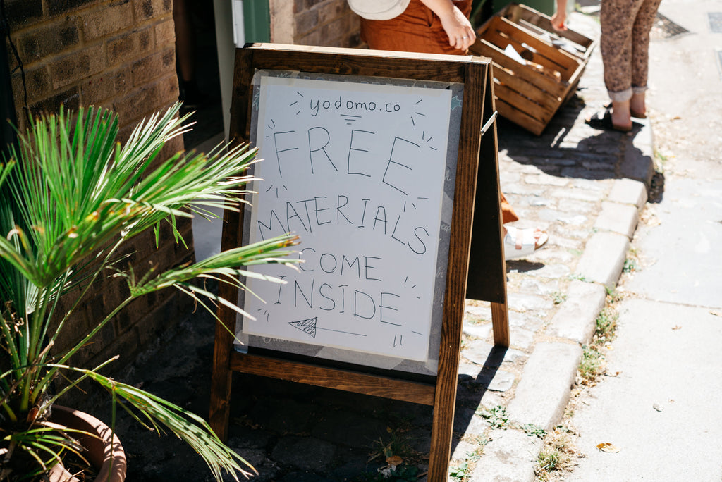 Sign outside Yodomo Reuse Hub saying "Free Materials, Come Inside"