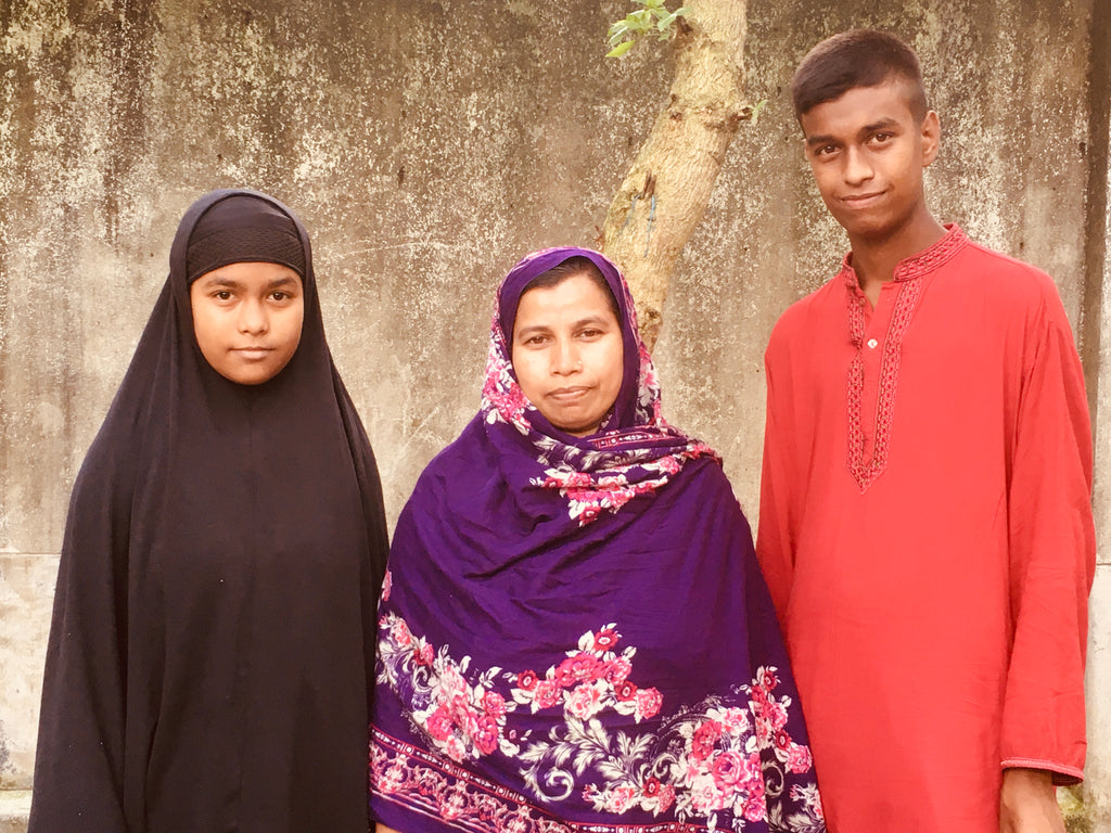 Three Bengali people standing for a portrait