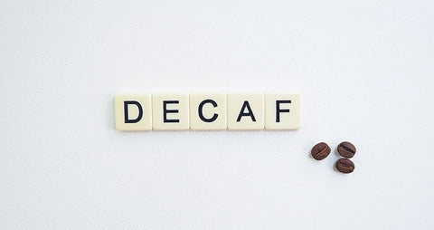 Decaf written in scrabble tiles - How is coffee decaffeinated