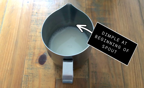 Where to fill the milk in the Barista Express jug
