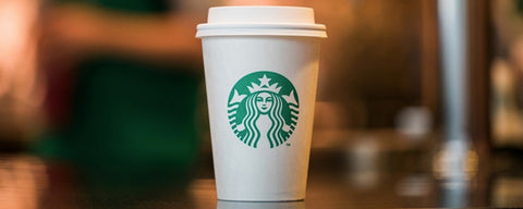 Starbucks caramel macchiato in a disposable cup