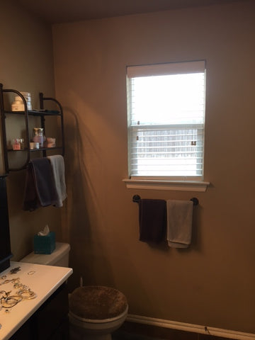 add dark shelf above toilet