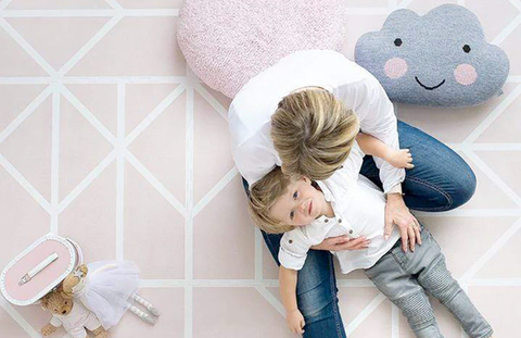 Mother and child on playmat