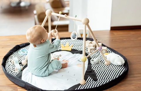 Baby playing on playmat