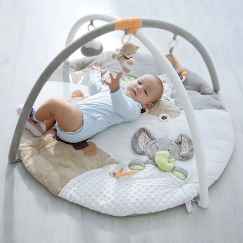baby playing with baby play gym