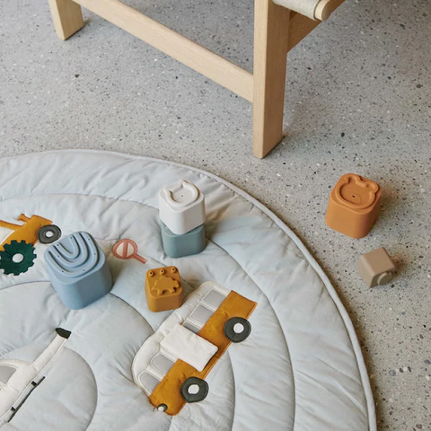 stacking blocks on play mat