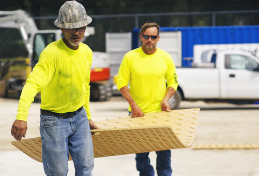 Men carrying Mats