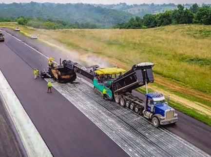 Construction using paving fabrics