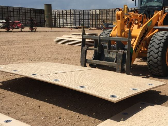 MegaDeck Mat being moved on job site