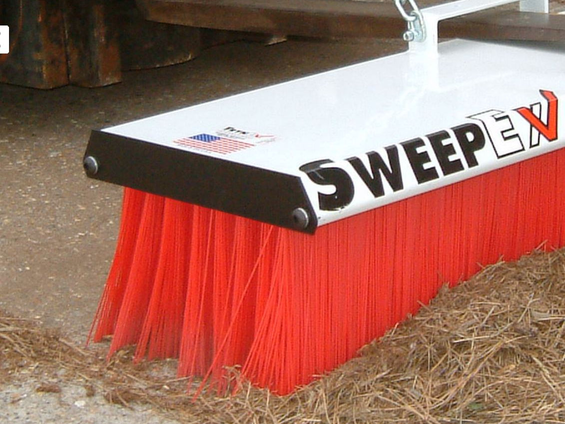 Forklift Broom sweeping a warehouse