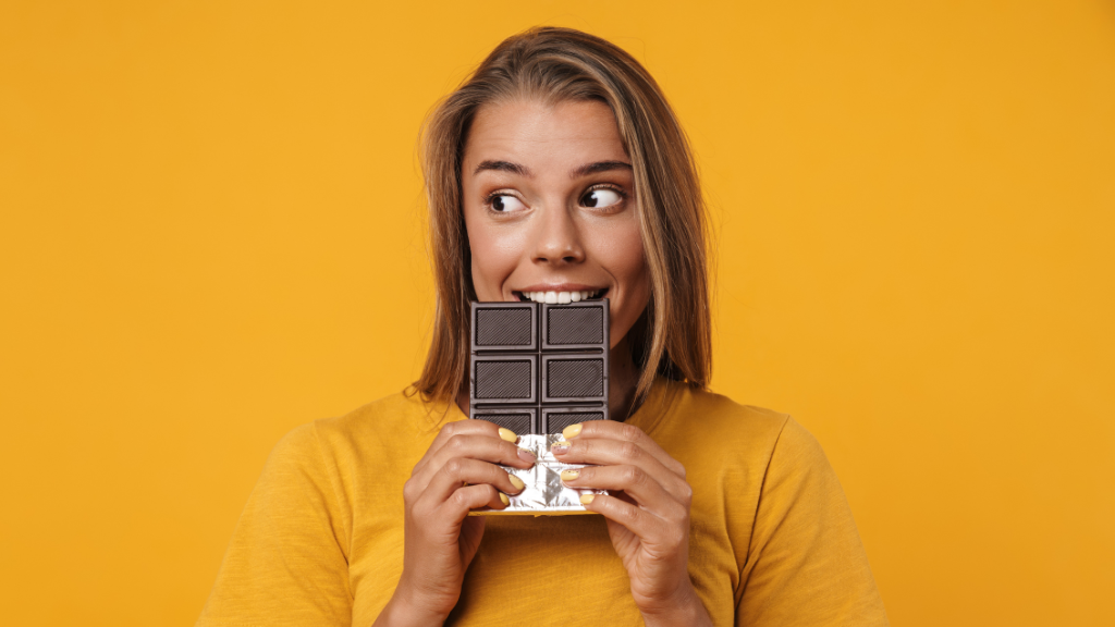 Woman Eating Chocolate Bar