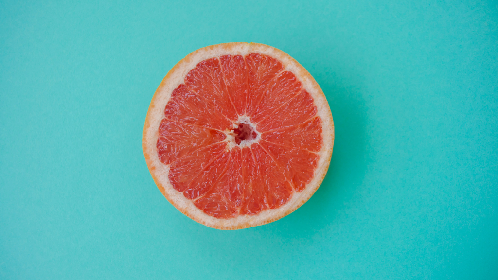 Grapefruit against a blue background