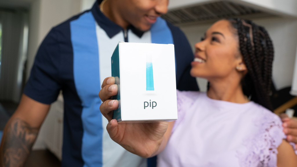 Couple holding Pip Lancet Box and smiling