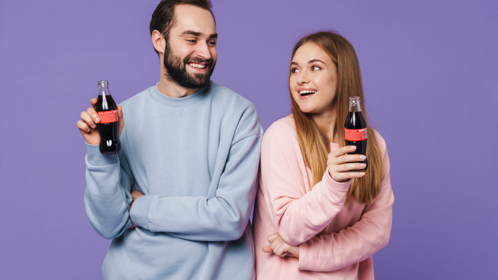 Two people drinking coke 