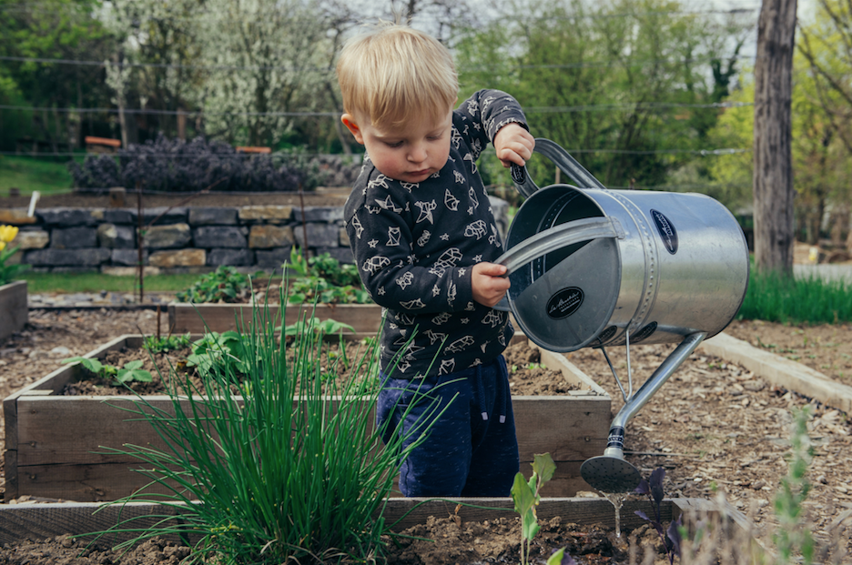 earth day child watering 