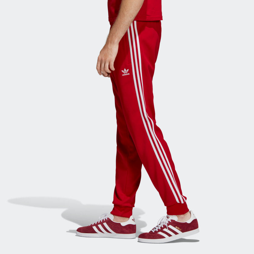 red and white adidas track pants