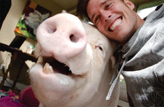 The Author Smiling Beside Esther the Wonder Pig