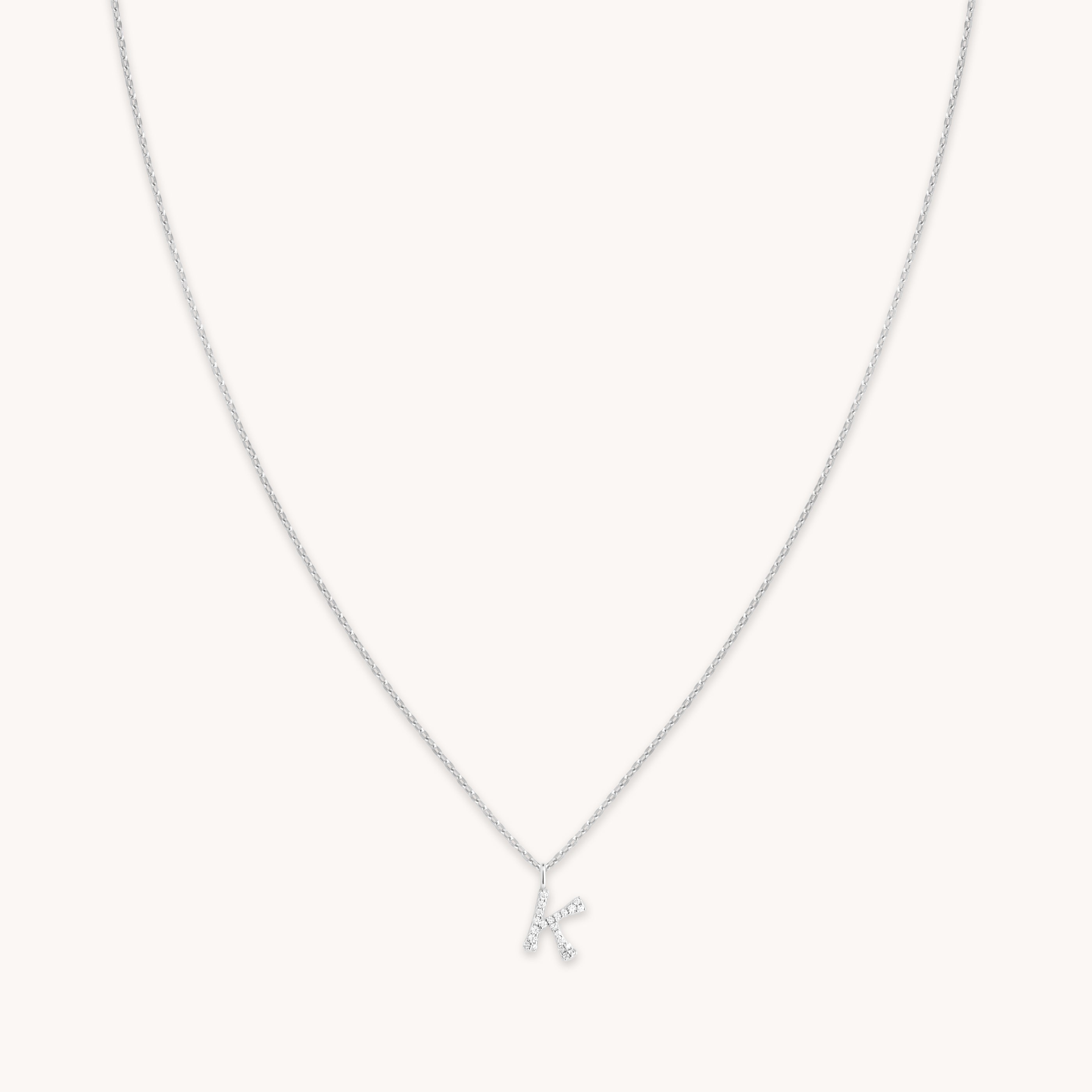 Astrid &amp; Miyu Initial Pave Pendant Necklace K In Silver In Metallic
