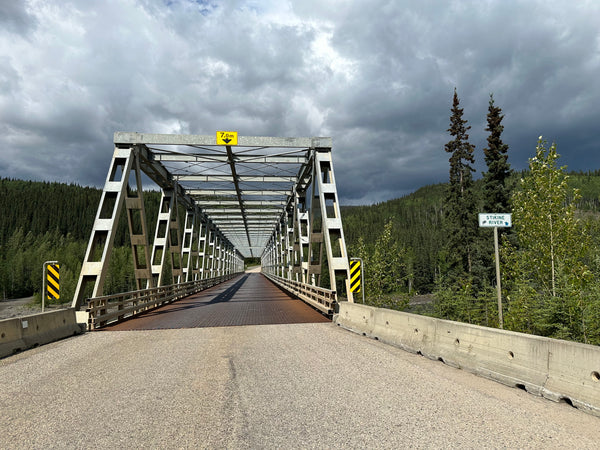Metal bridge that spans over the Stikine River in British Columbia