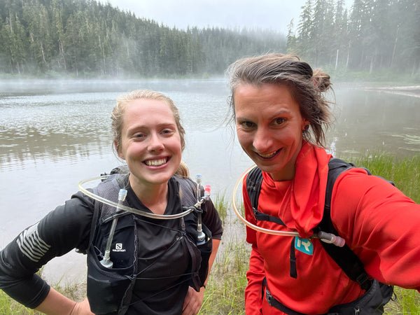 Trail runners at a lake