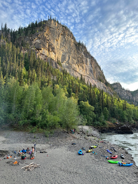 Wolf Tracks Camp and the crew hanging out on the river bank.