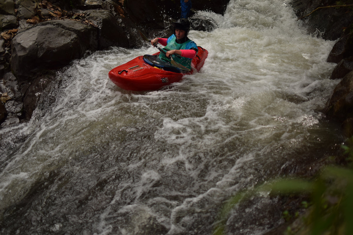 Kayaker approaching the lip of a rapid on the Alseseca river. 