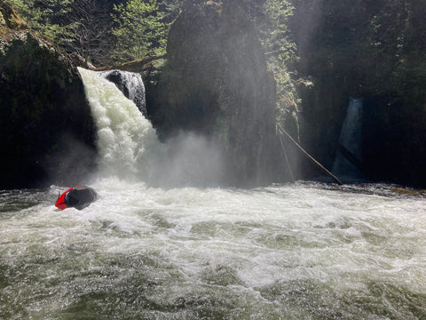 Packrafter flipping over after running Split Falls on the Salmon River Gorge in Oregon