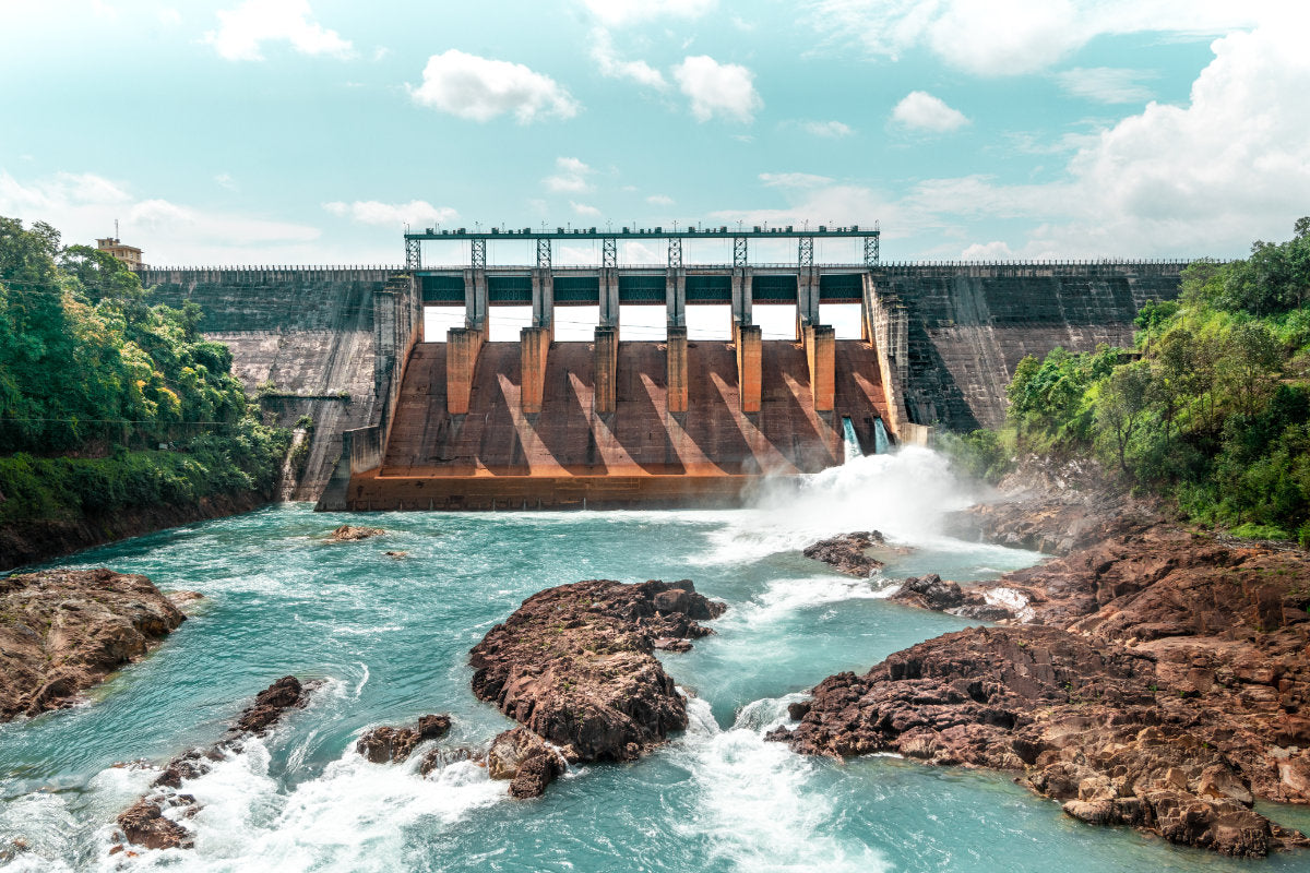 Kopili River Dam with water flowing out of the outflow