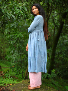 Side view of model wearing of Handwoven Gathered waist cotton dress, designed by Khumanthem Atelier