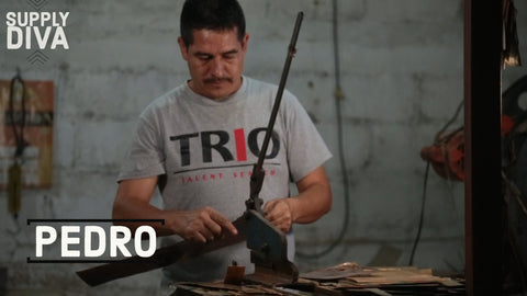 Pedro cutting sheets of metal