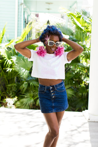 Sequin crop top and pom pom earrings