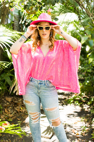 Pink sequin tunic and rhinestoned hat