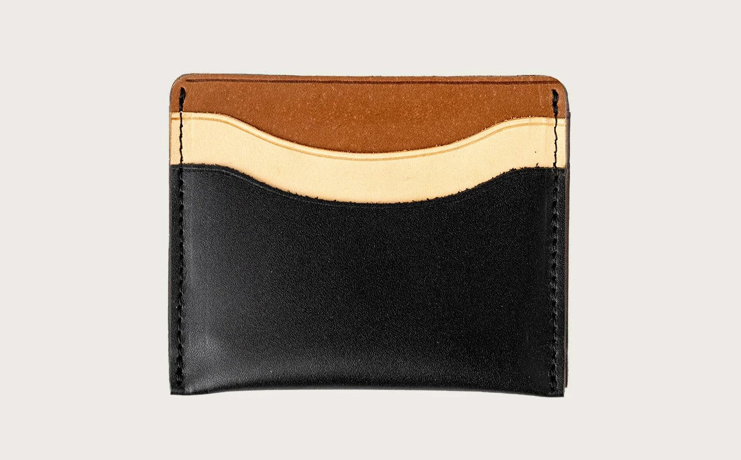 A mixed black small card leather wallet from WP Standard, ideal for minimalist lifestyles.