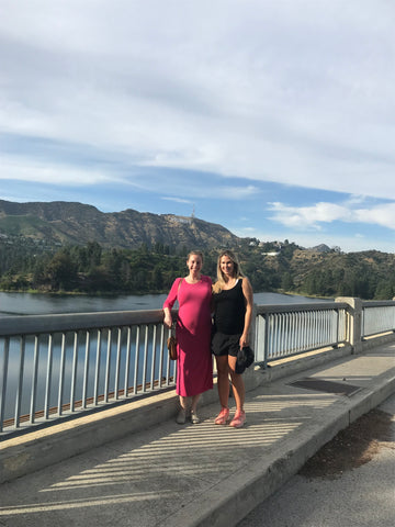 Two friends outside with Hollywood Sign in background