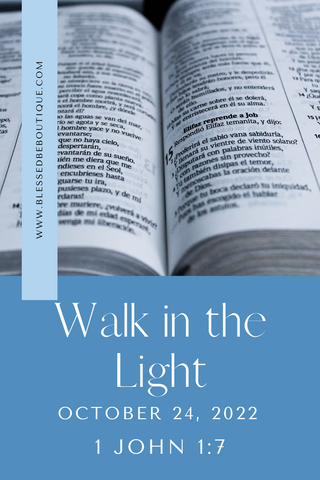 Image of an open bible with the words "walk in the light, October 24, 2022, 1 John 1:17"