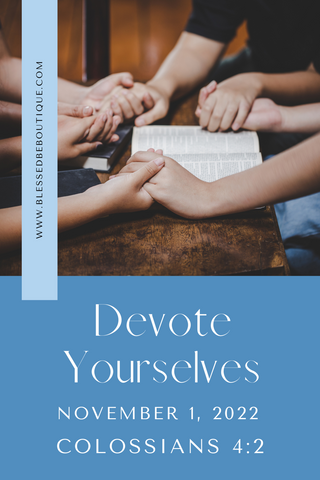 Image of a group of people holding hands surrounding an open Bible with the words "devote yourselves, November 1, 2022, Colossians 4:2"