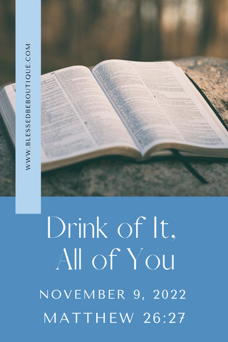 Image of an open bible on a rock with the words "drink of it, all of you, november 9, 2022, matthew 26:27"