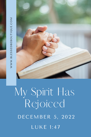 Image of clasped hands praying over a Bible with the words "My Spirit has Rejoiced December 5, 2022, Luke 1:47"