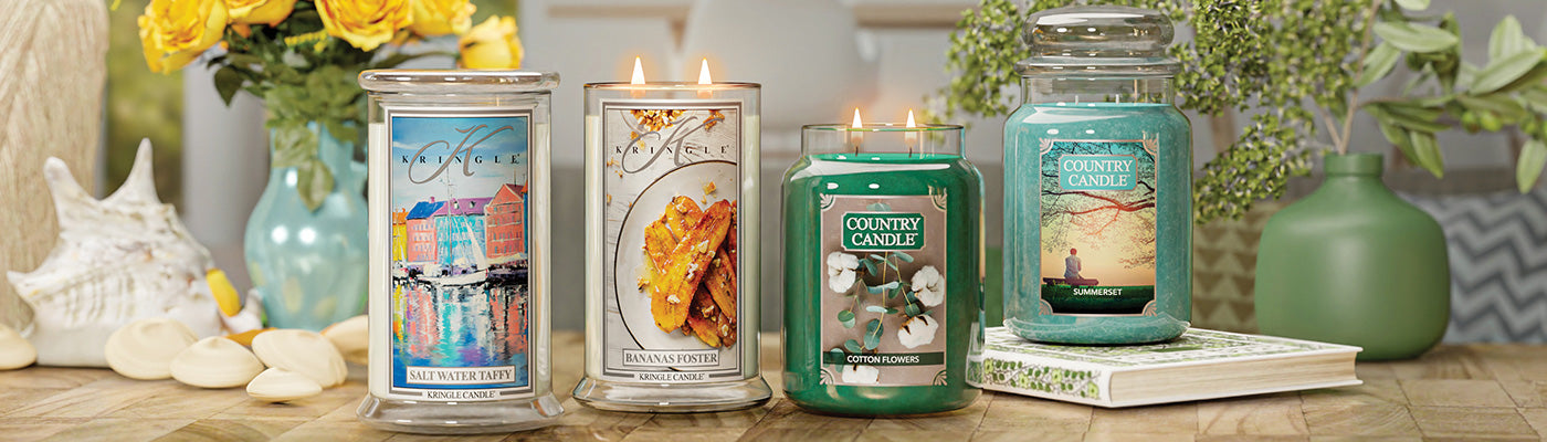 Kringle and Country Candle large jars with a summer floral and beach background.